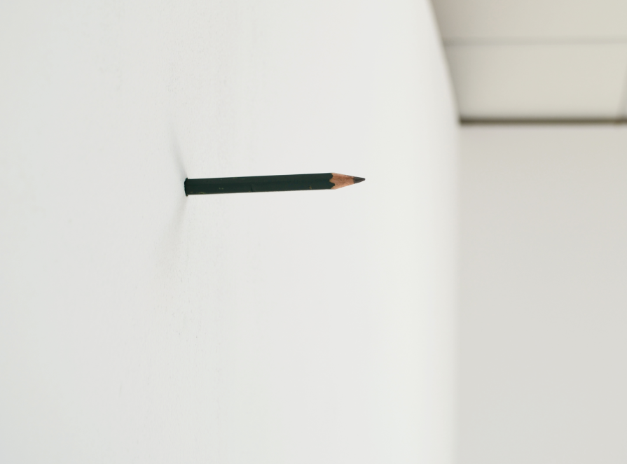 Writing device for a wall