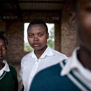 Students at the Groupe Scolaire Cyumba gather outside a new classroom being constructed. Students at the Groupe Scolaire Cyumba gather outside a new classroom being constructed.