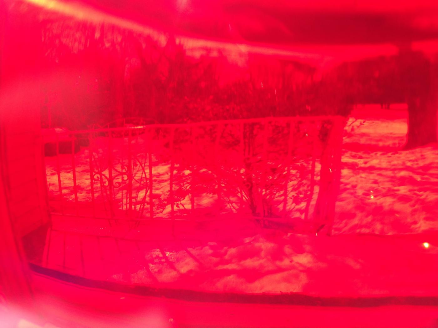 Portrait through a red glass heart
