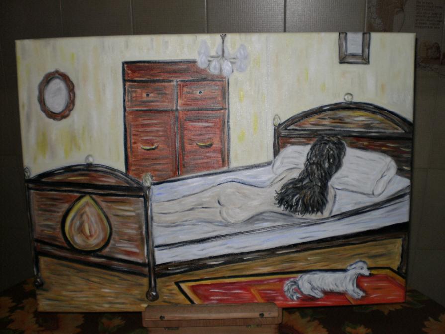 Donna nuda di spalle sul letto