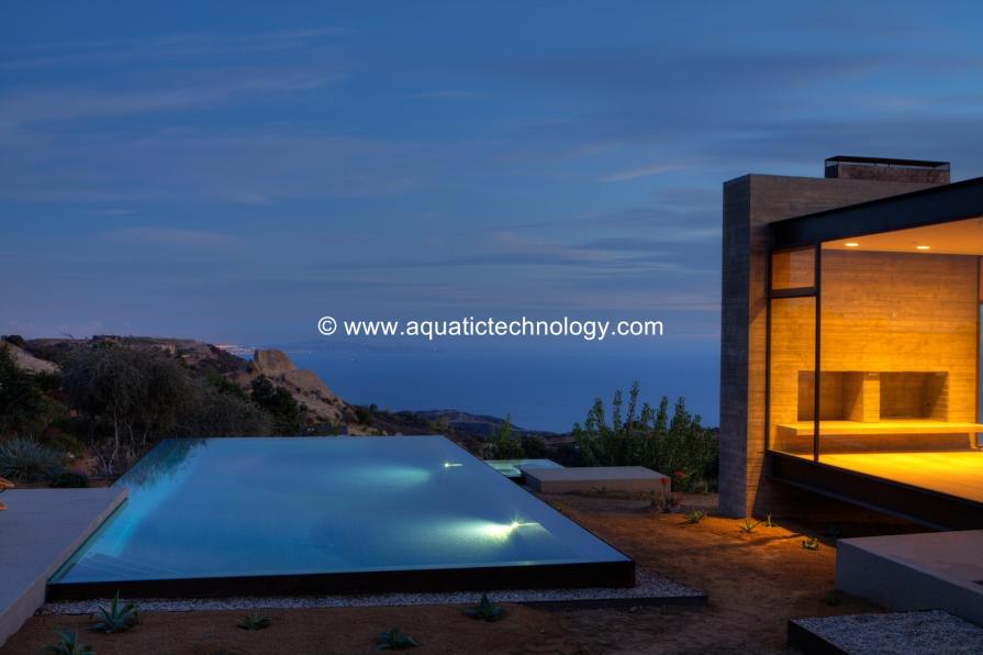 Overflow pool and spa, glass tile mosaics, fire feature, vanishing edge, infinity edge